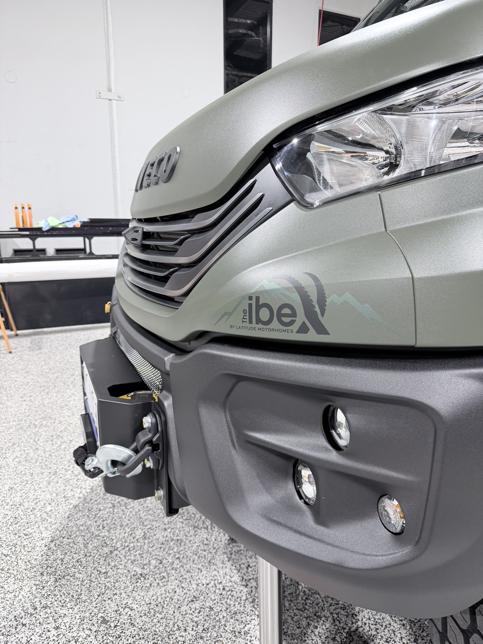 Close-up of The ibeX by Latitude Motorhomes badge on the front panel