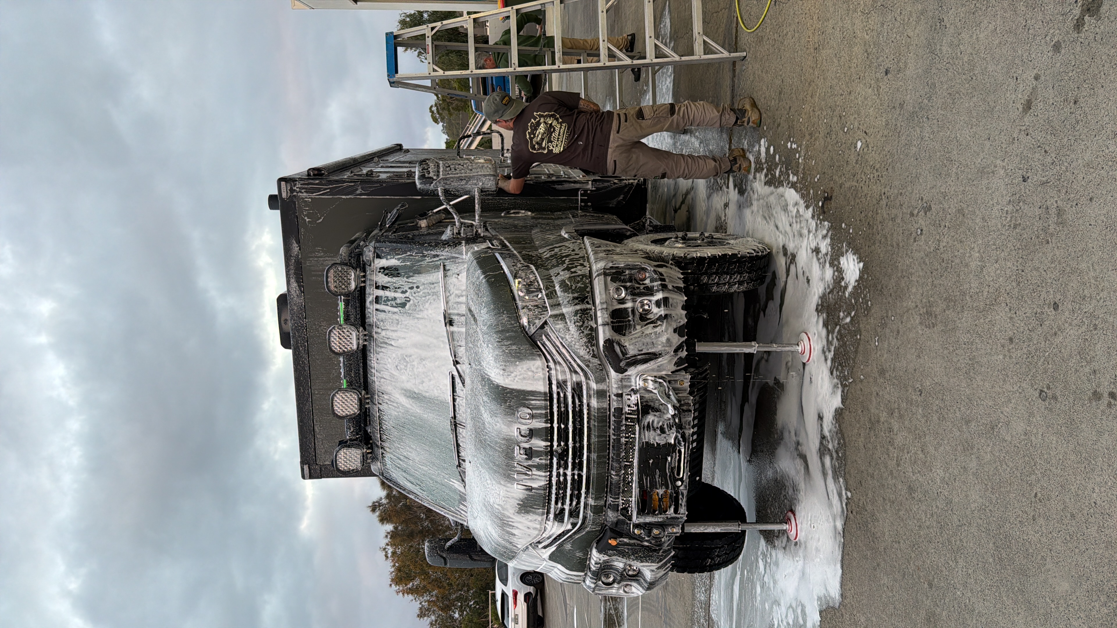 ibeX being foam-washed down outside the Latitude Motorhomes workshop