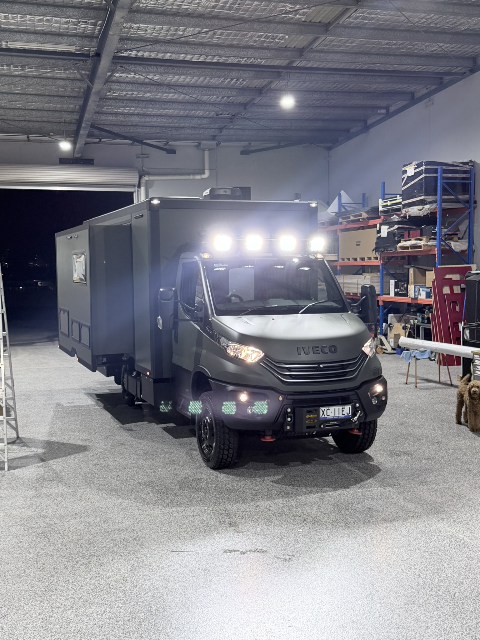 ibeX front three-quarter at night with habitat slide-out extended